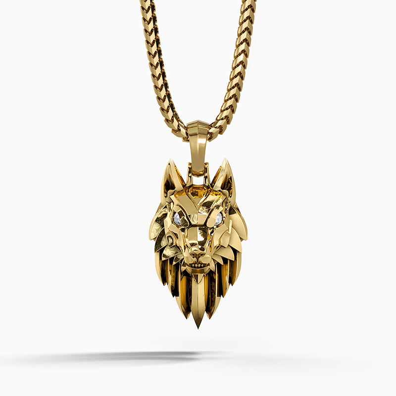 a sleek gold wolf pendant with diamond eyes hangs from a franco chain