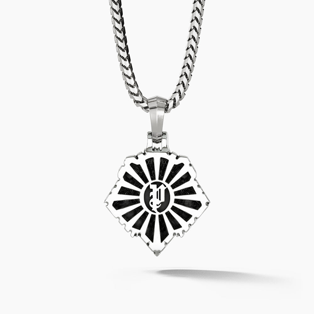 The back of a silver lion pendant features a sunburst pattern and the Proclamation Jewelry logo