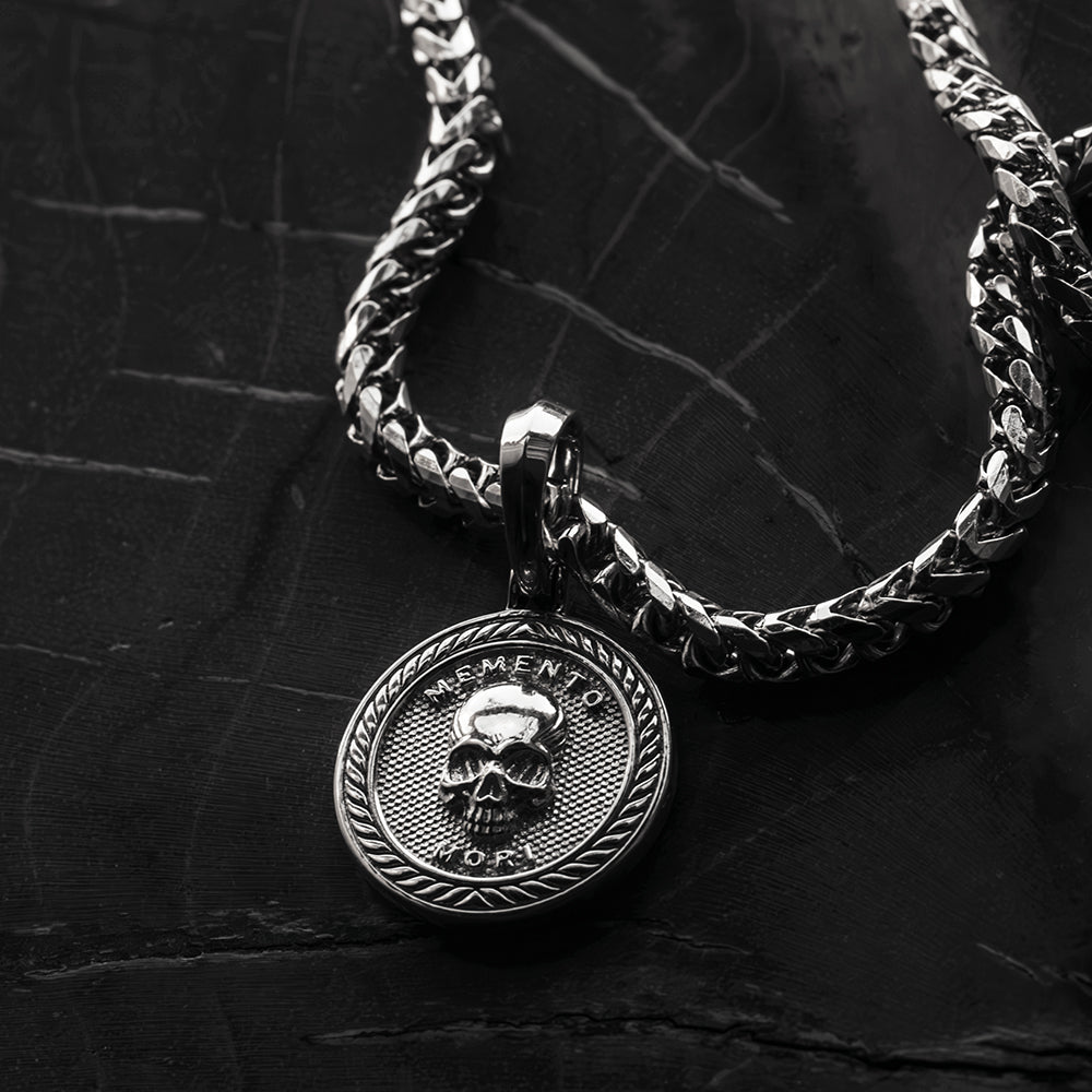 a solid silver memento mori skull pendant necklace 