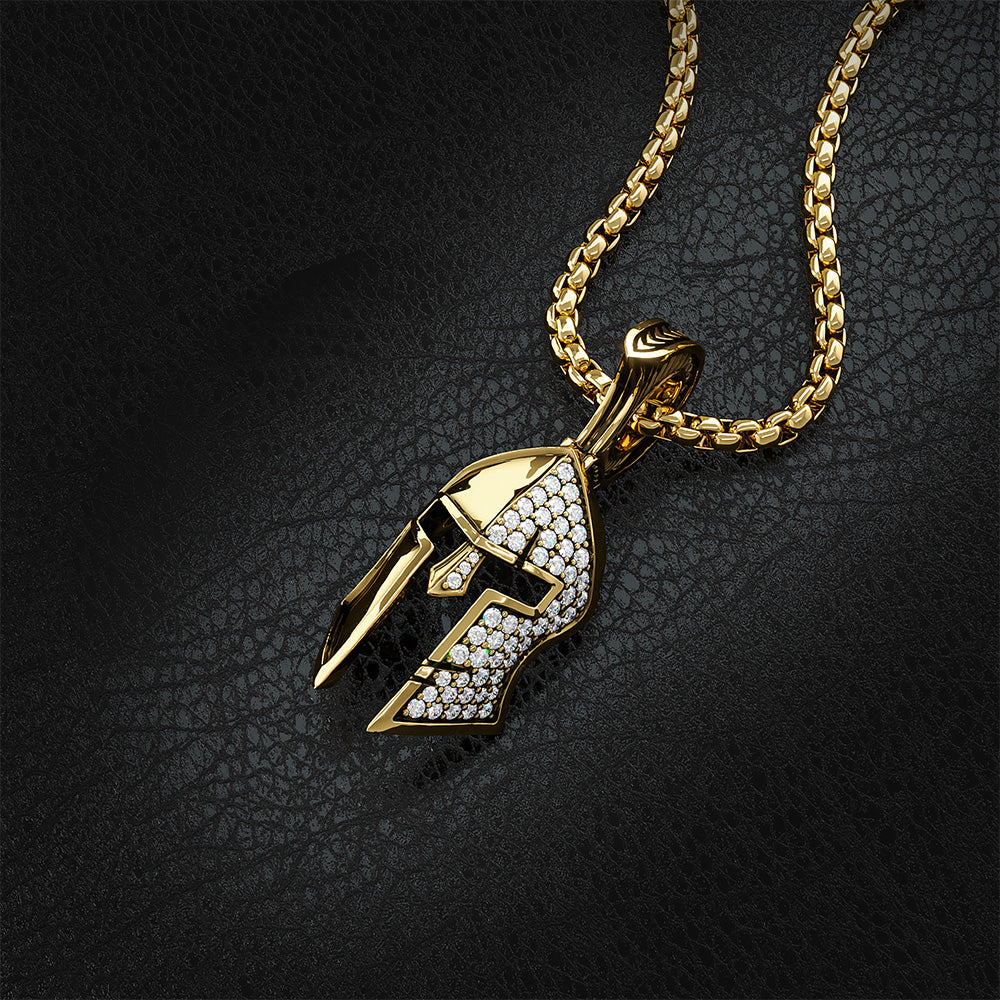 a solid gold Spartan pendant with diamonds pave'd on half of the helmet lays on a black leather surface