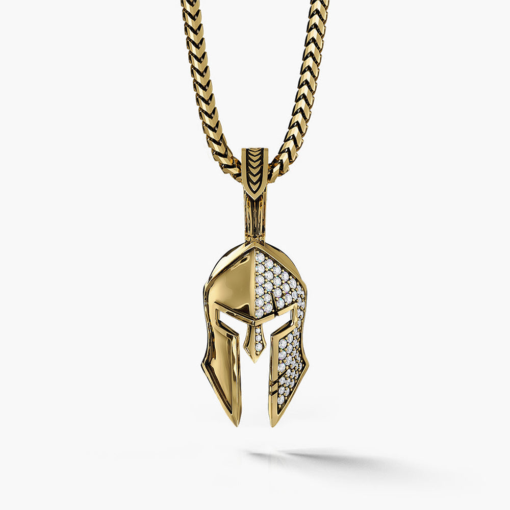 a gold Spartan pendant with half of the helmet covered in diamonds