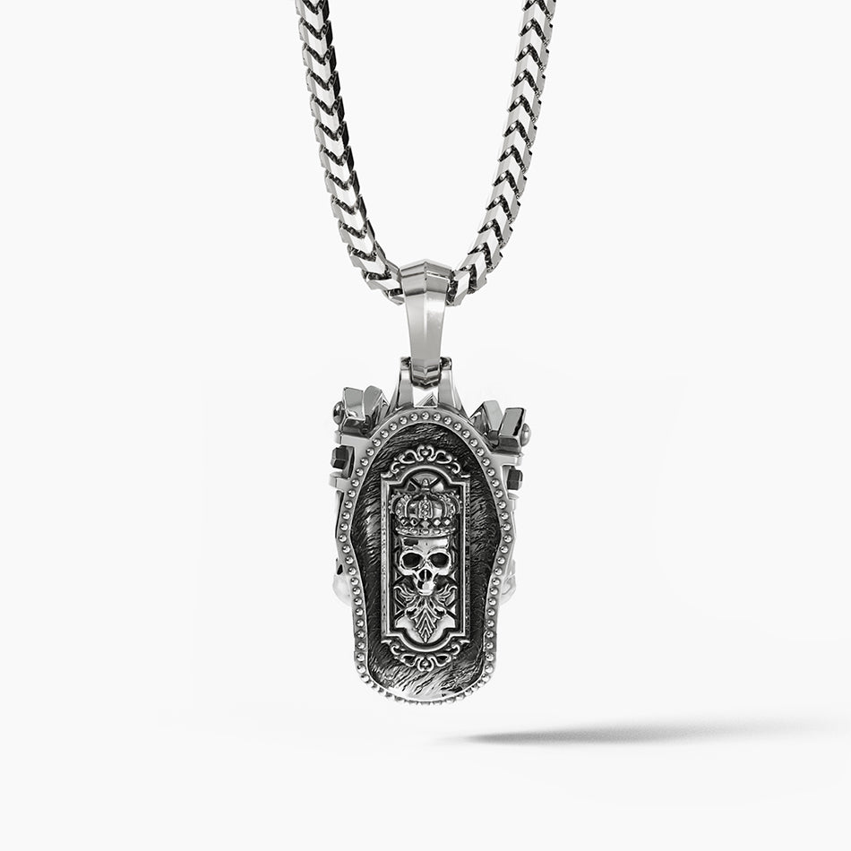 The back of a skull pendant shows a throne carved into the metal