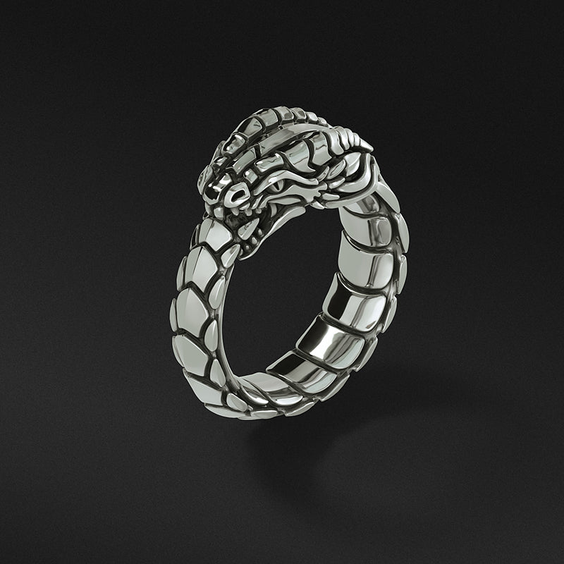 a dragon ring with fierce eyes and engraved scales stands up