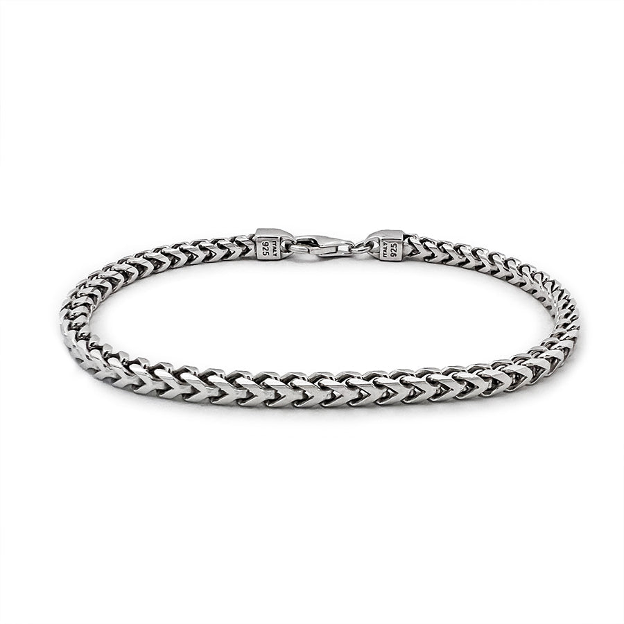 a 4mm silver franco bracelet for men lies on a white surface